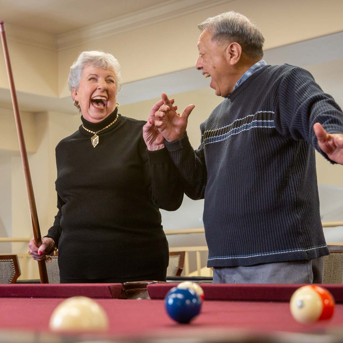 Residents playing billiards at Camden Springs